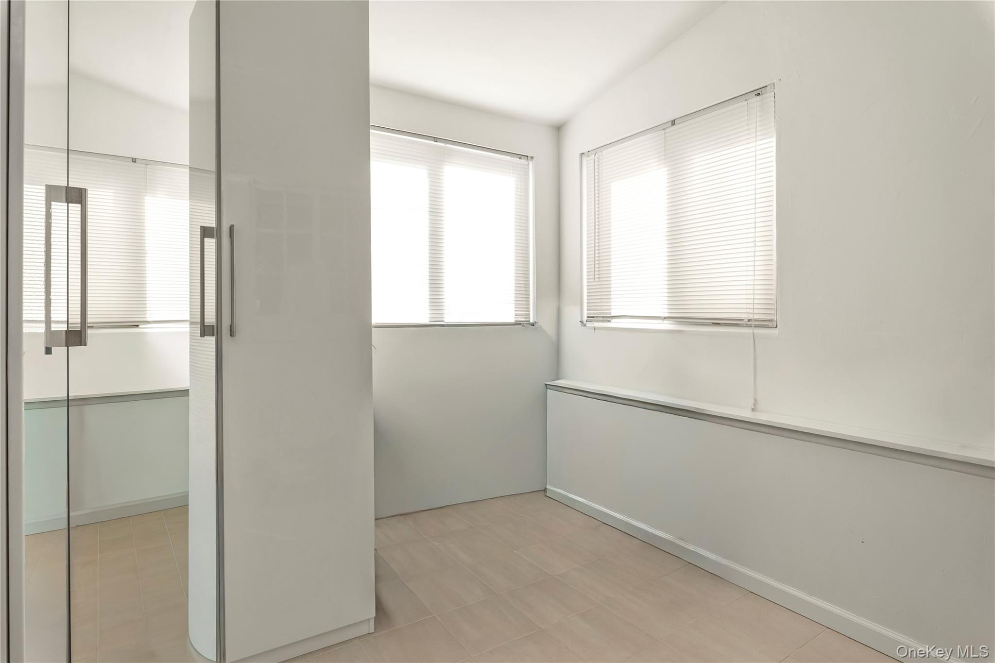 82-31 165th Street Queens, NY 11432 - Photo 7 of 16 a view of an empty room with a window