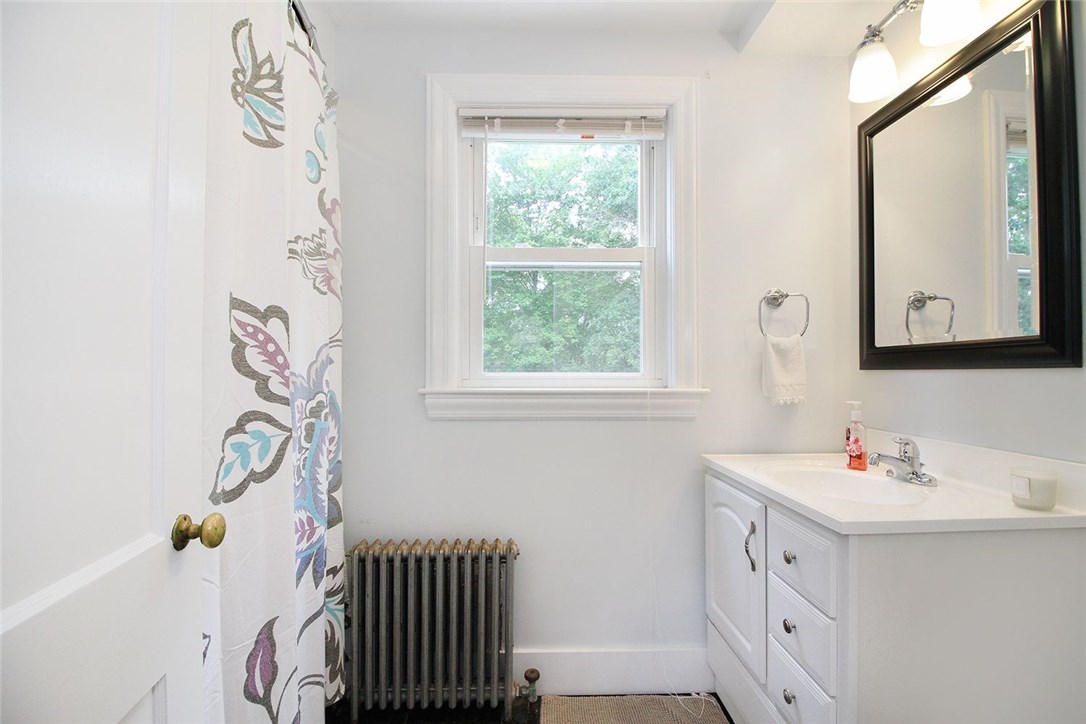 183 Fish Road Tiverton, RI 02878 - Photo 15 of 38 Lovely downstairs bathroom with shower and tub.