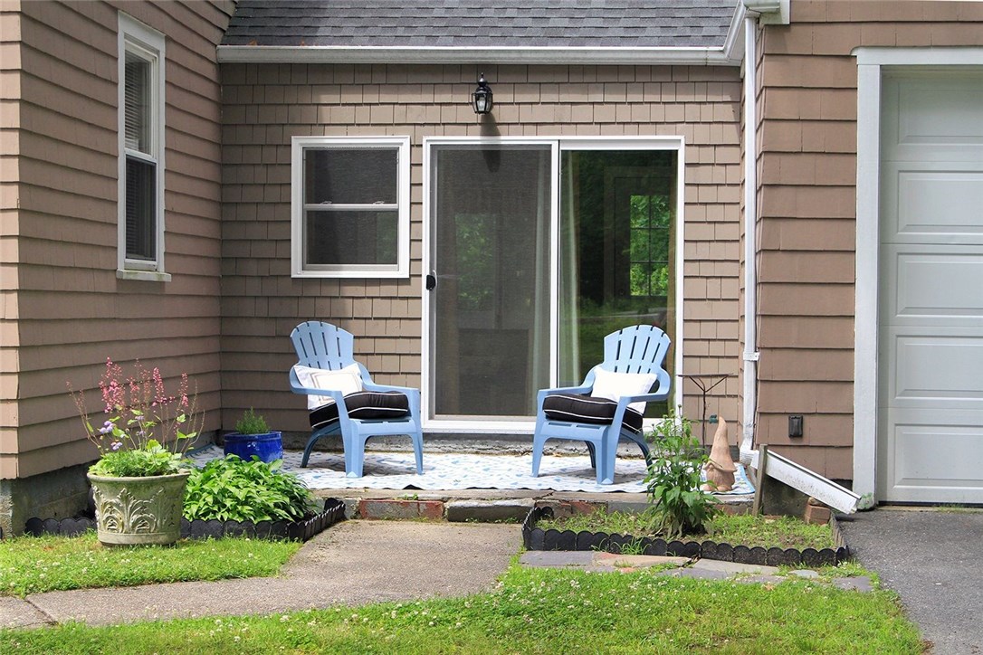 183 Fish Road Tiverton, RI 02878 - Photo 32 of 38 Lovely patio off the breezeway/sunroom.