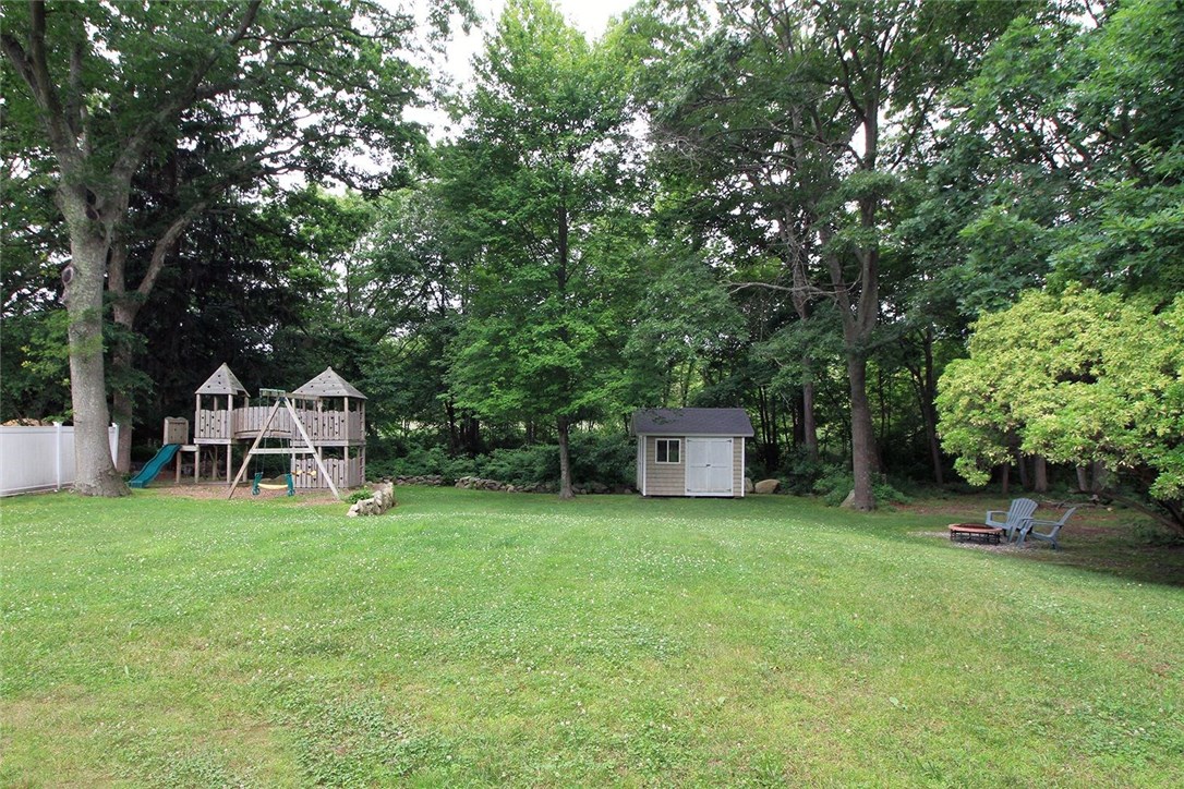183 Fish Road Tiverton, RI 02878 - Photo 34 of 38 Large backyard with shed, children's play area and fire pit.