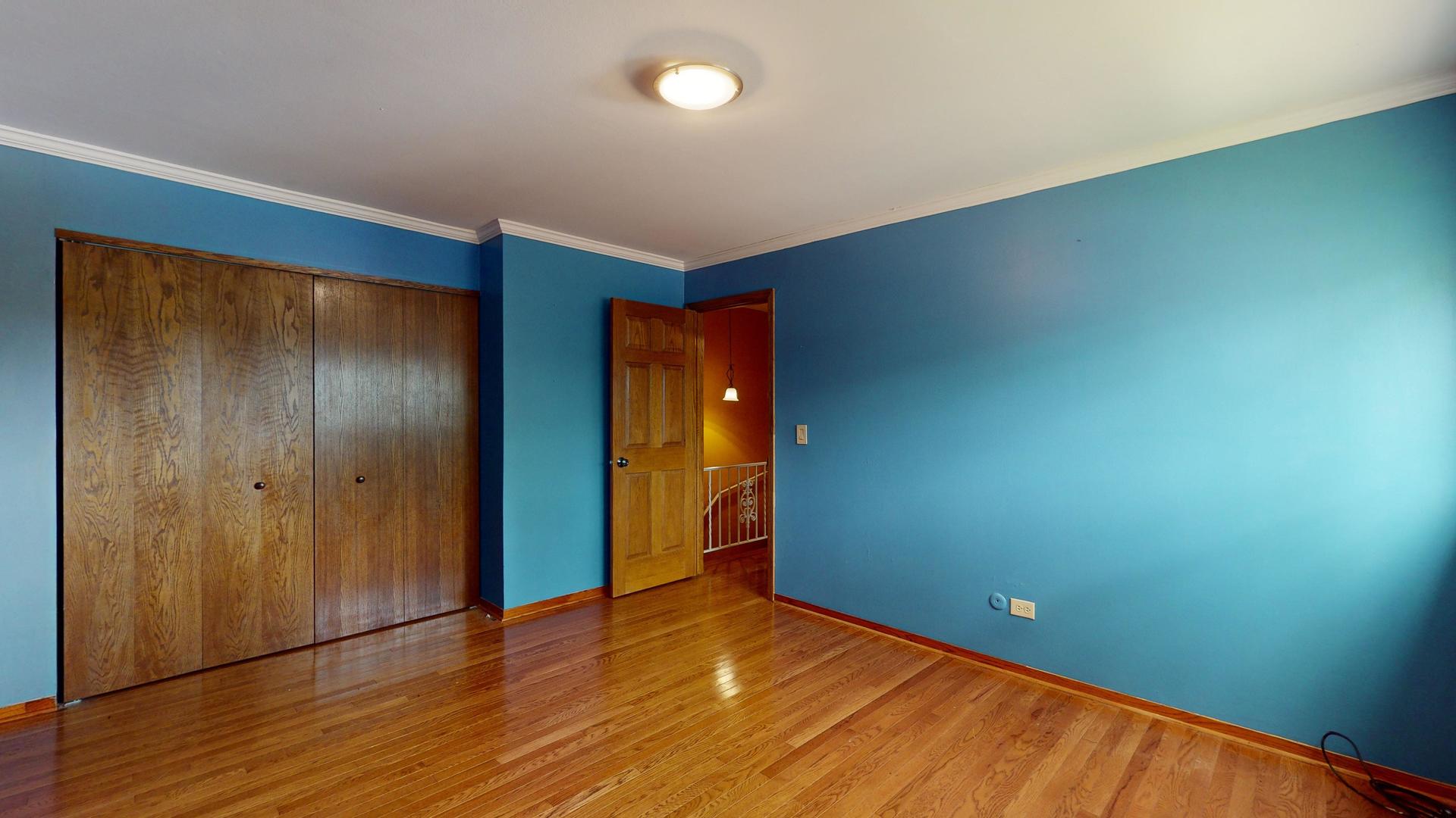 2302 West Algonquin Road, Unit 12 Rolling Meadows, IL 60008 - Photo 14 of 22 a view of empty room with wooden floor
