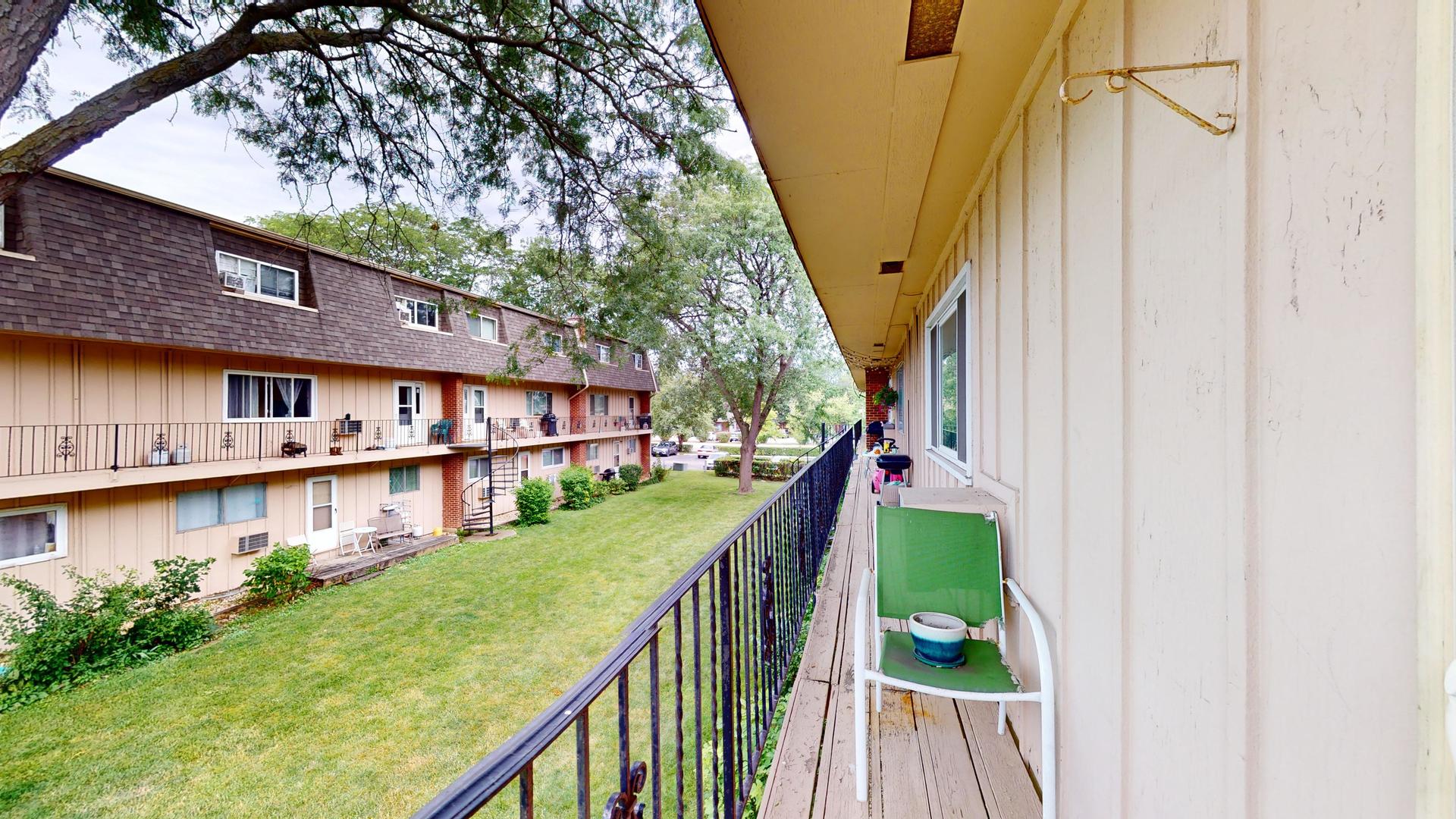 2302 West Algonquin Road, Unit 12 Rolling Meadows, IL 60008 - Photo 15 of 22 a view of swimming pool with a house in the background