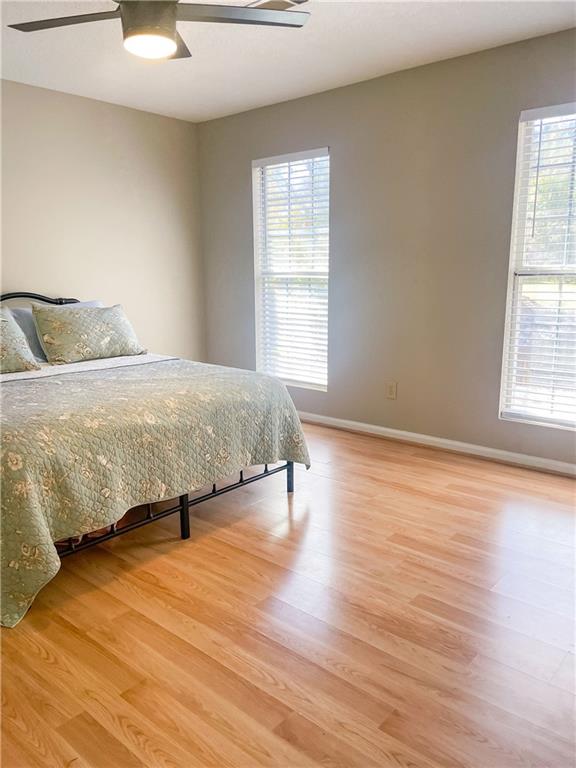 280 Mimosa Road Phenix City, AL 36870 - Photo 22 of 38 Bedroom featuring light wood-style floors and a ceiling fan