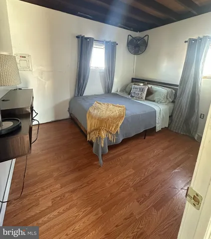 a bed room with a bed and a mirror