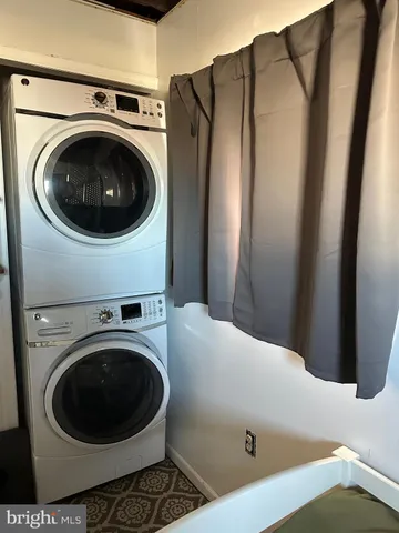 a close view of a utility room with dryer and washer
