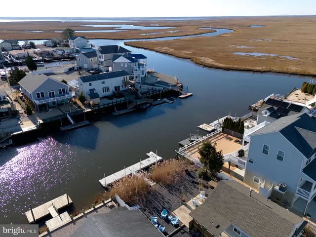 an aerial view of houses with ocean view
