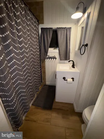 a bathroom with a sink and mirror