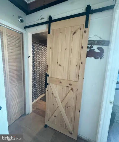 an aerial view of a house with a yard basket ball court and outdoor seating