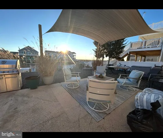 a front view of house with a garden