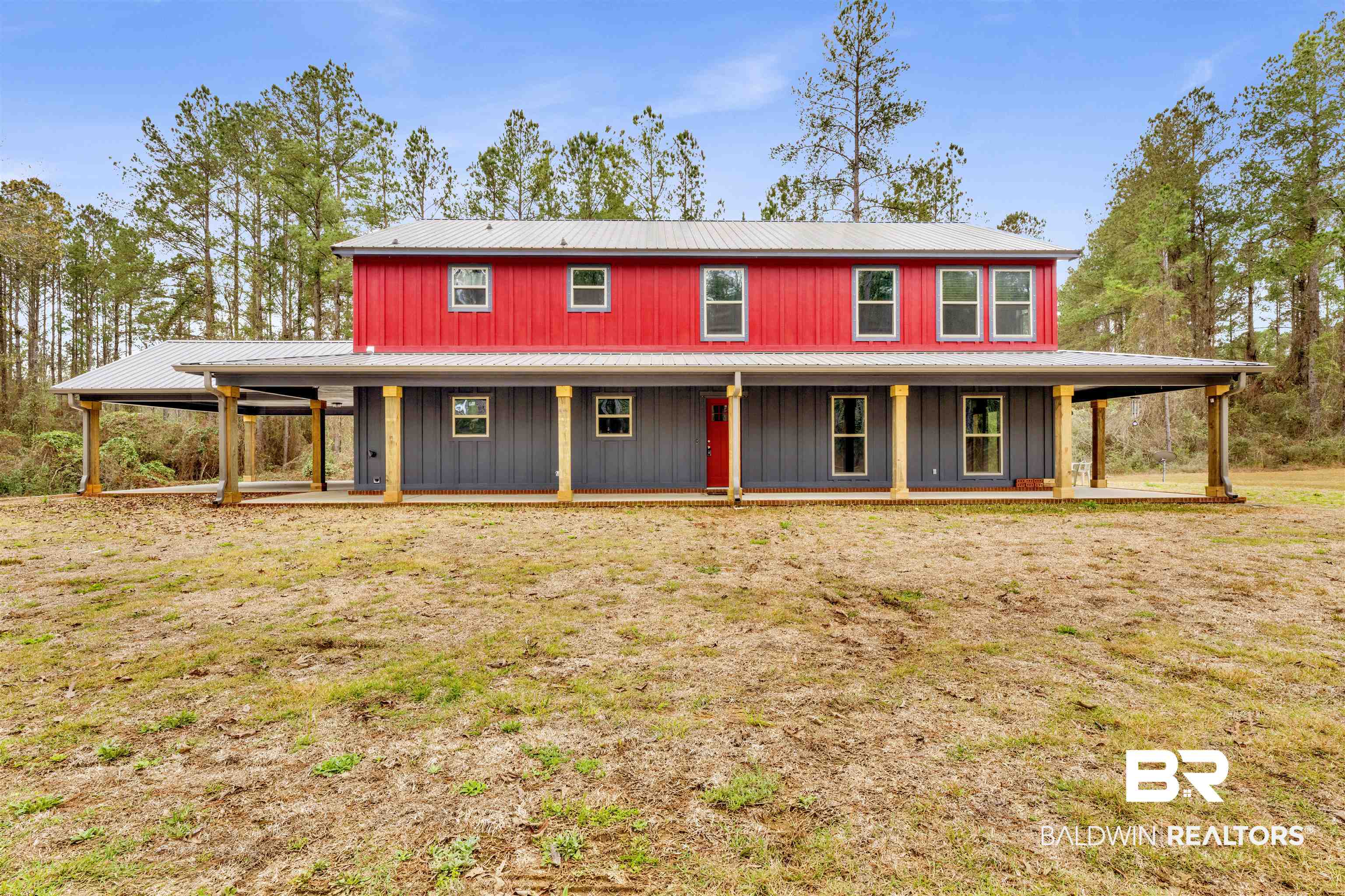 36397 Alexandria Trail Stapleton, AL 36578 - Photo 20 of 65 Farmhouse inspired home featuring a large porch, a front lawn, and a metal roof