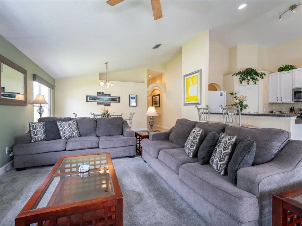 641 Old Bridge Circle Davenport, FL 33897 - Photo 13 of 28 a living room with furniture and painting on the wall