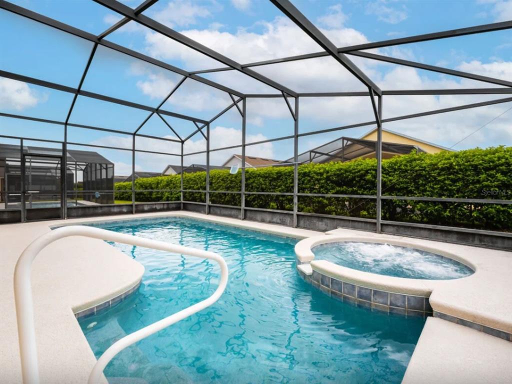 641 Old Bridge Circle Davenport, FL 33897 - Photo 3 of 28 a view of a white building with swimming pool