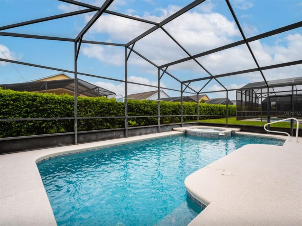 641 Old Bridge Circle Davenport, FL 33897 - Photo 4 of 28 a view of a swimming pool with a porch