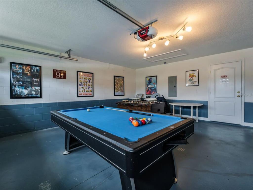 641 Old Bridge Circle Davenport, FL 33897 - Photo 7 of 28 a room with pool table and flat screen tv