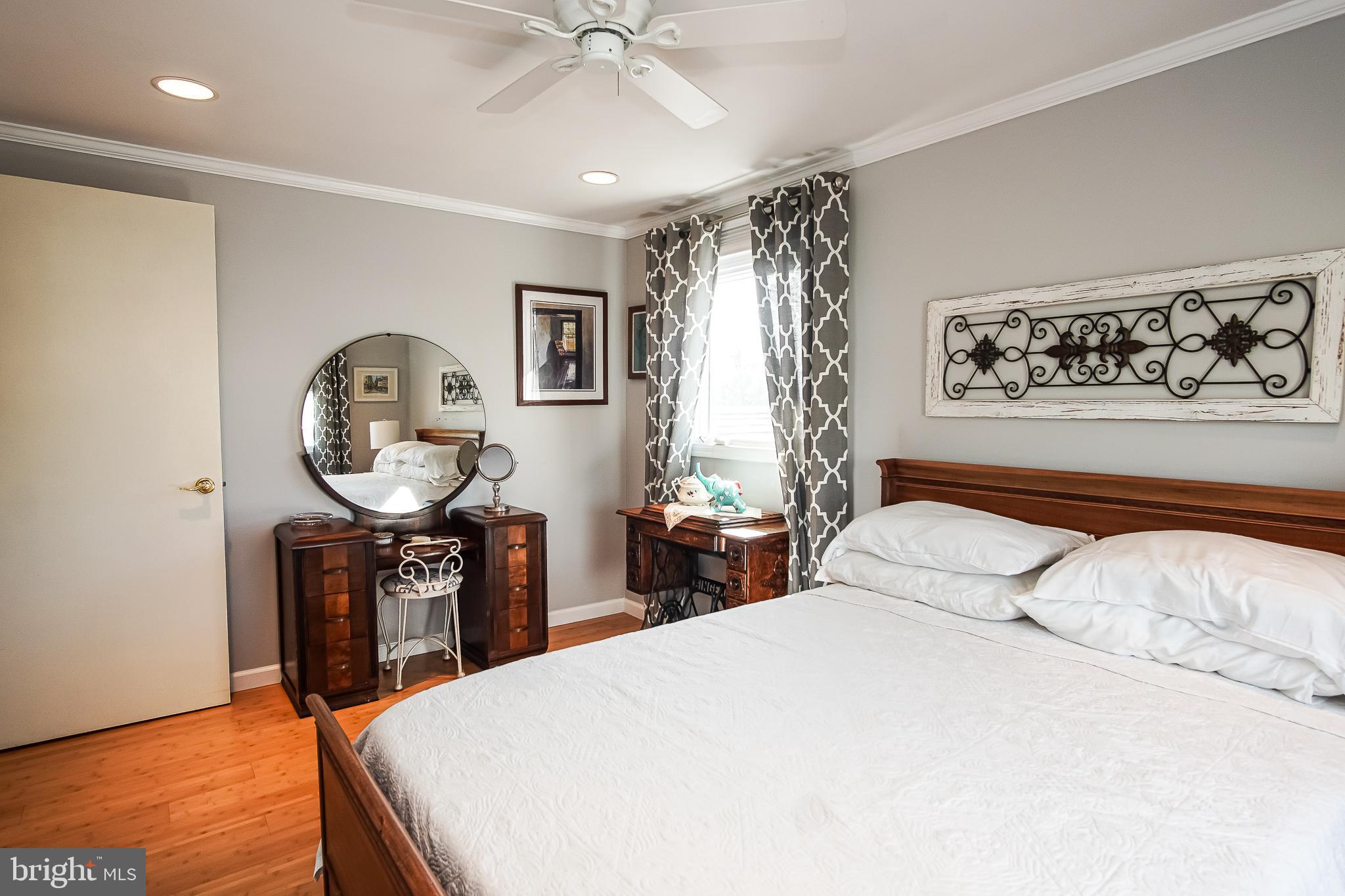 35 Walkill Road Tuckerton, NJ 08087 - Photo 12 of 42 a bedroom with a bed a mirror on dresser and a table