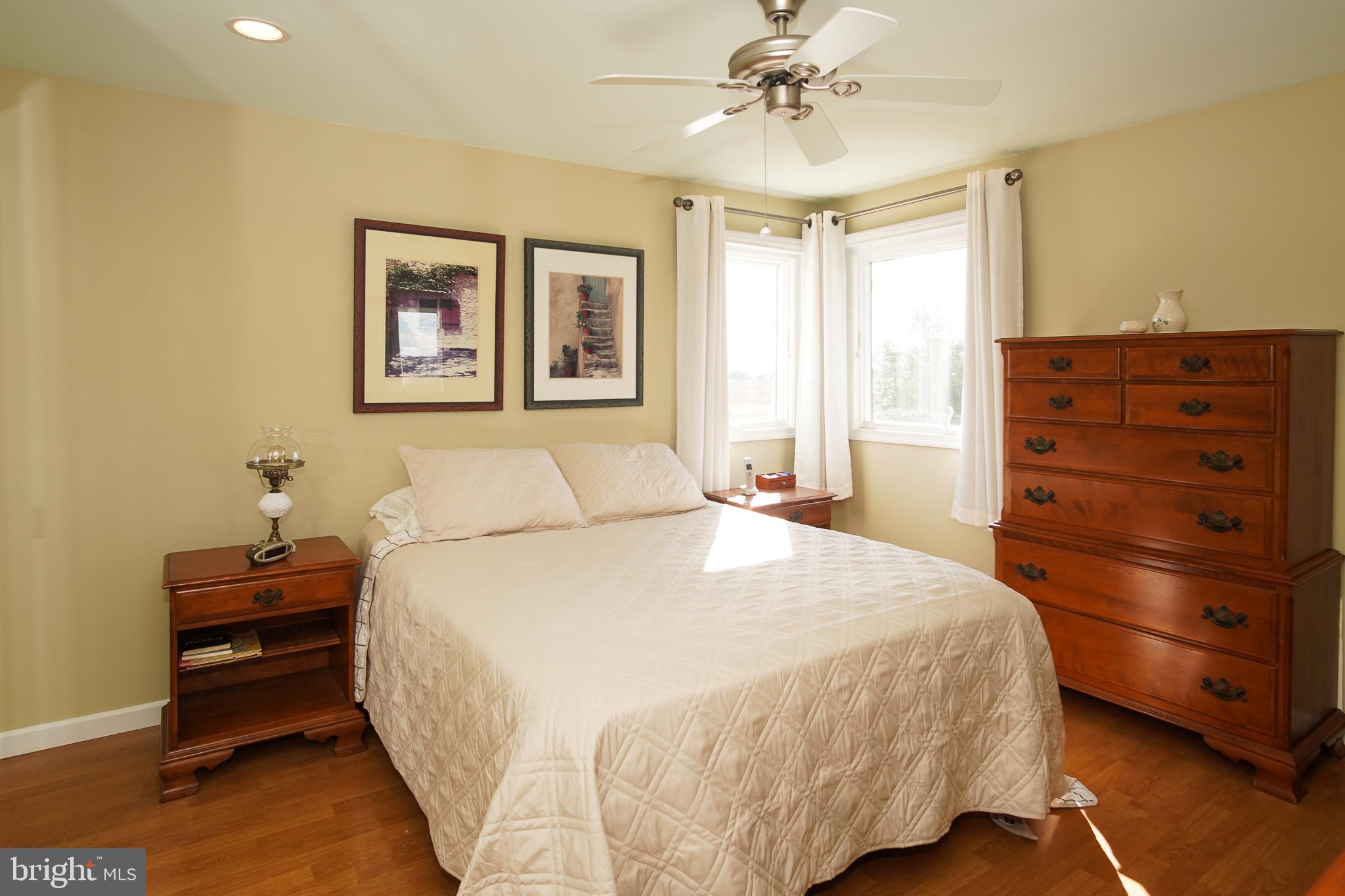 35 Walkill Road Tuckerton, NJ 08087 - Photo 21 of 42 a bedroom with a bed and a chandelier