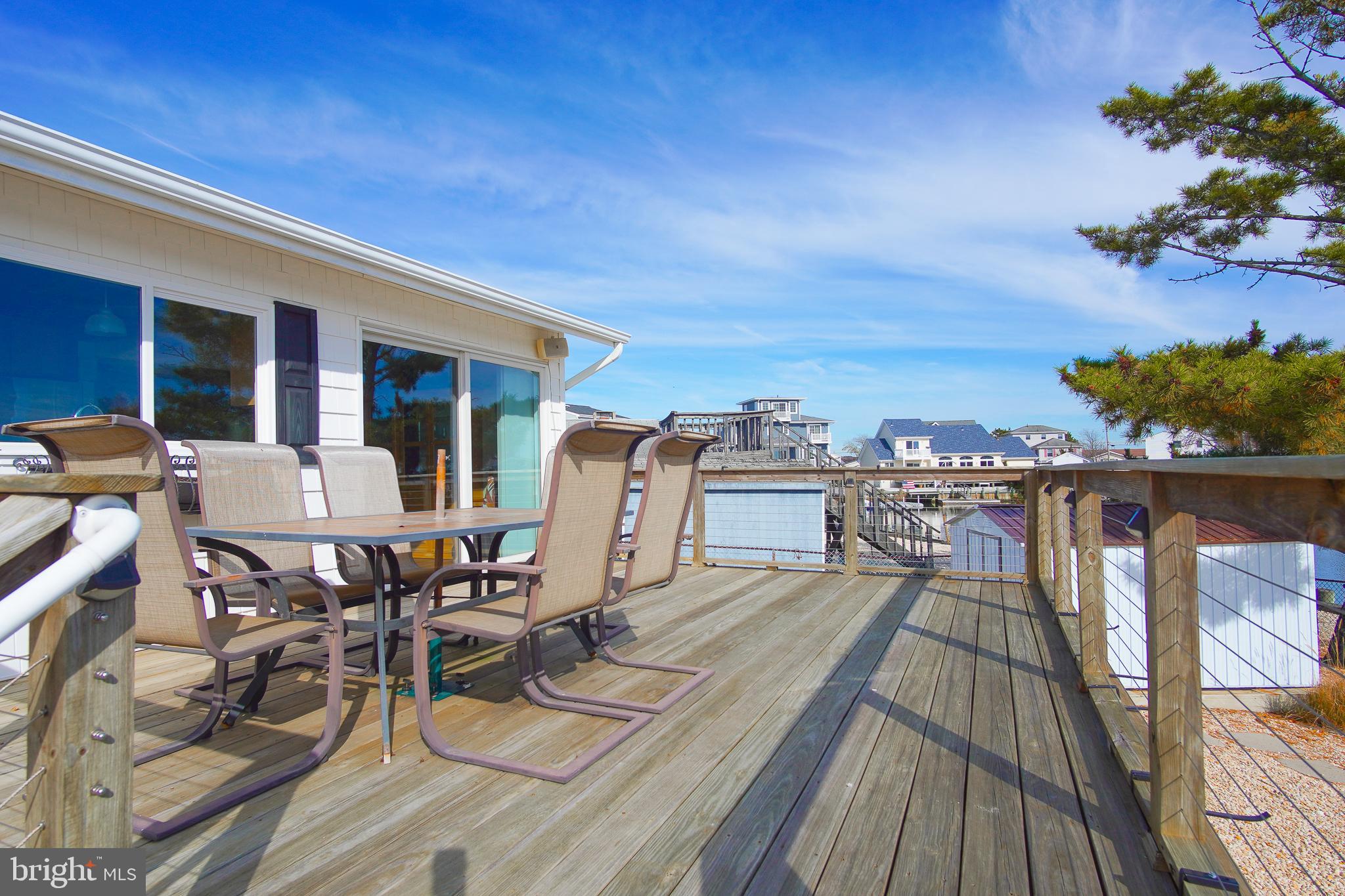 35 Walkill Road Tuckerton, NJ 08087 - Photo 29 of 42 a view of a roof deck with table and chairs