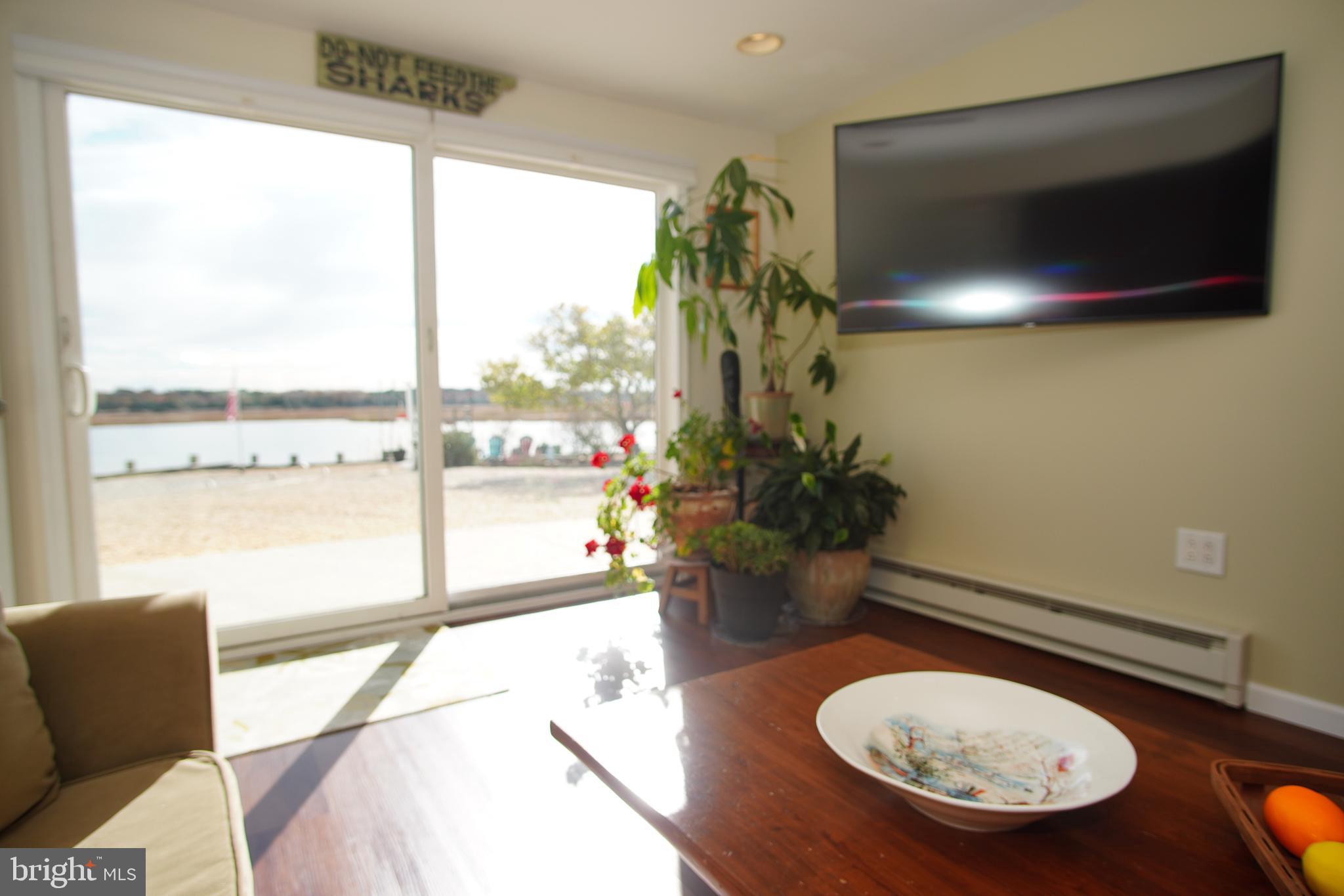 35 Walkill Road Tuckerton, NJ 08087 - Photo 5 of 42 a room with furniture and a floor to ceiling window