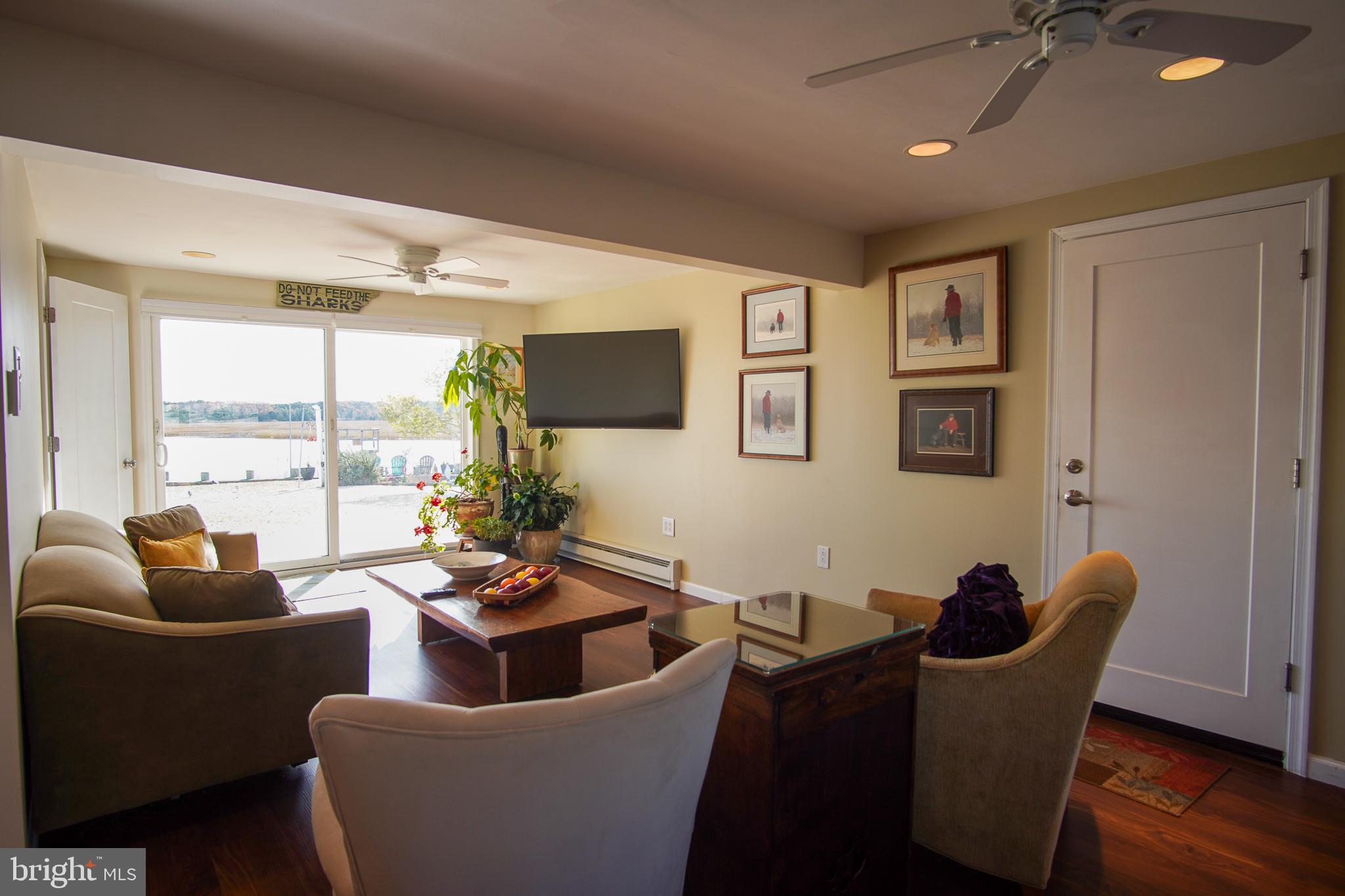 35 Walkill Road Tuckerton, NJ 08087 - Photo 6 of 42 a living room with furniture potted plant and a large window