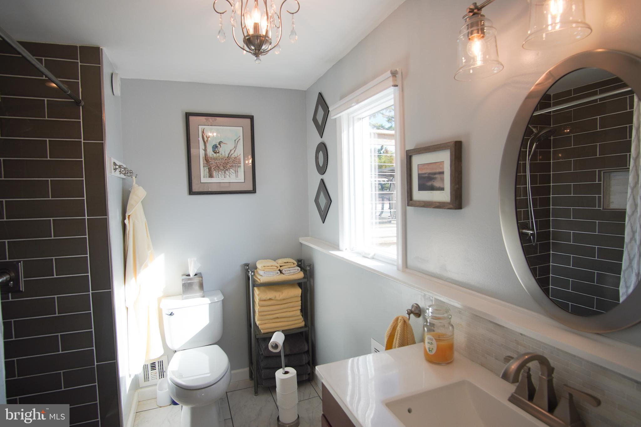 35 Walkill Road Tuckerton, NJ 08087 - Photo 8 of 42 a bathroom with a toilet a sink and mirror