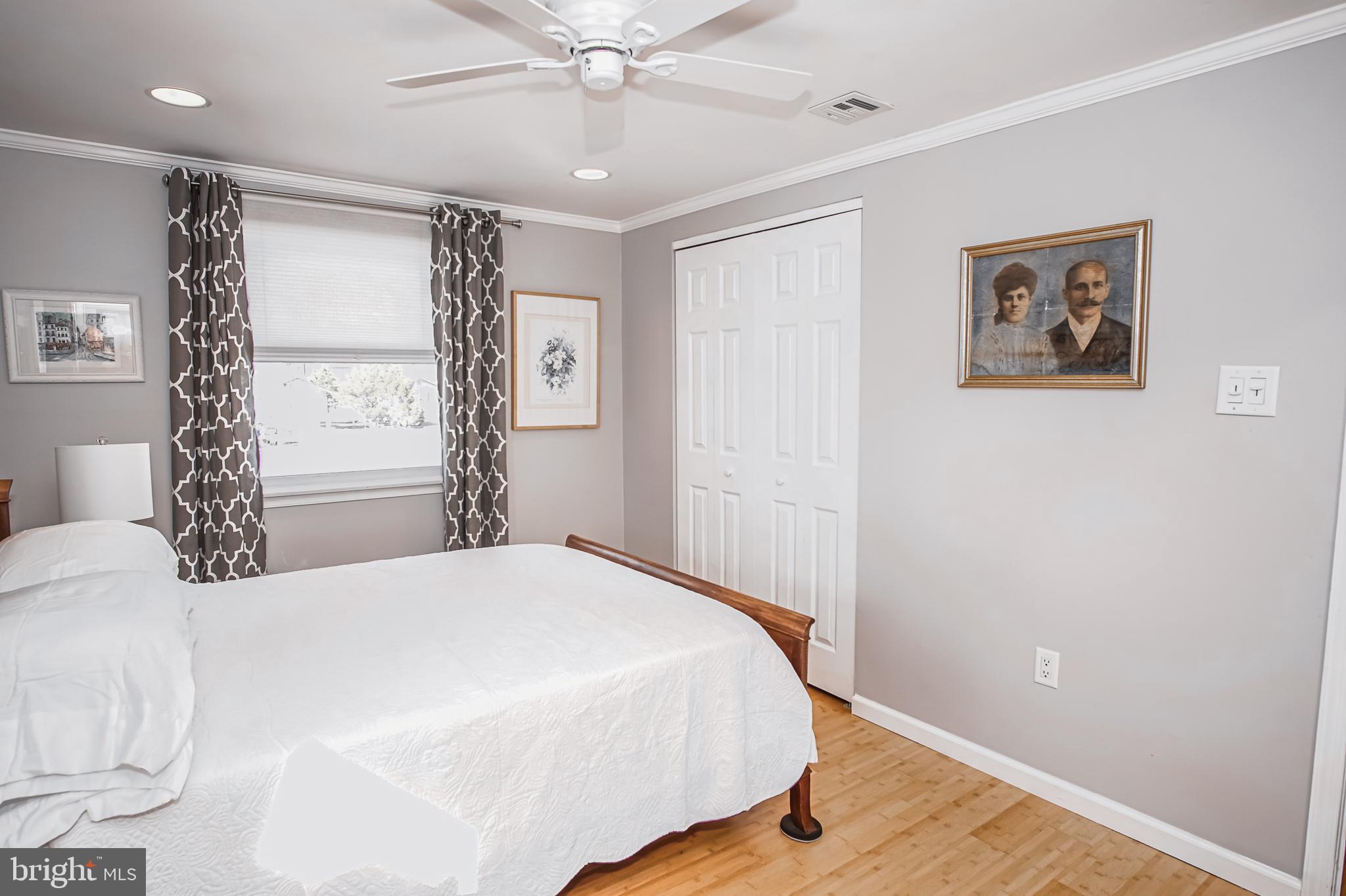 35 Walkill Road Tuckerton, NJ 08087 - Photo 10 of 42 a bedroom with a large bed and a chandelier