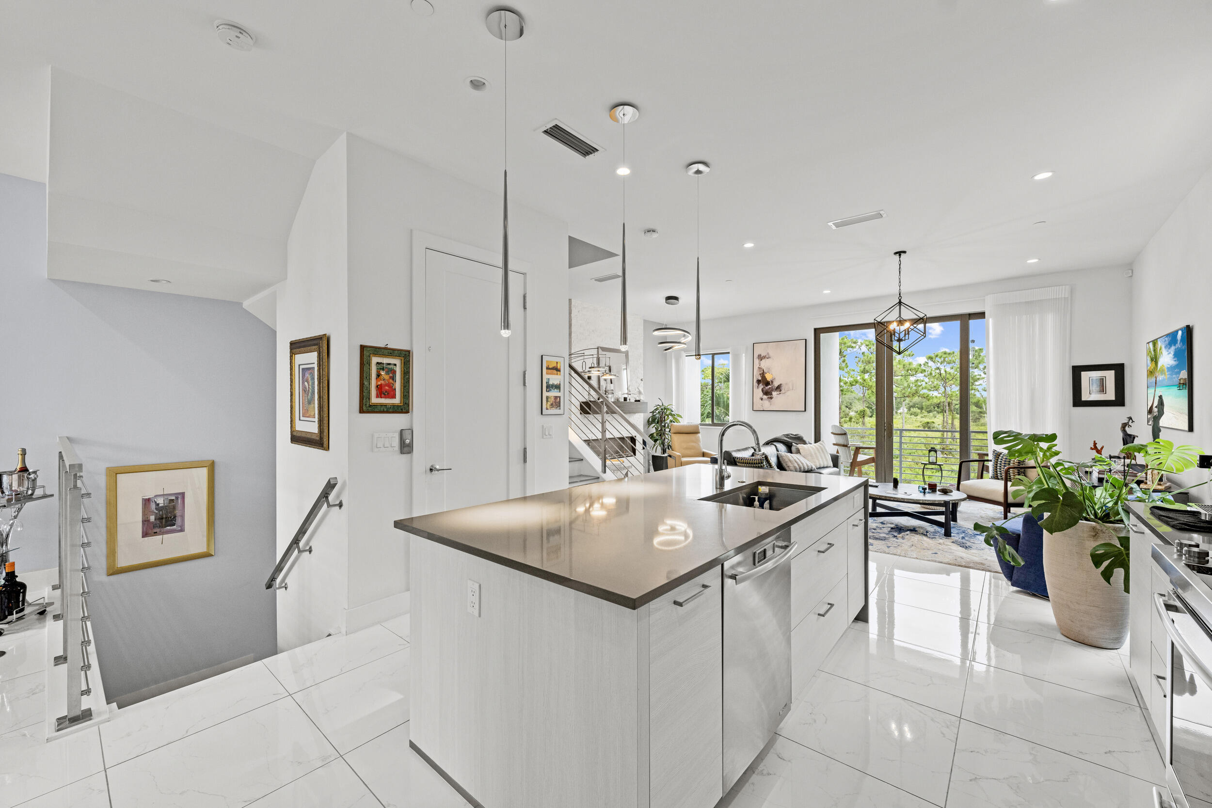 1811 Northwest 42nd Drive Boca Raton, FL 33431 - Photo 16 of 51 a kitchen with stainless steel appliances a sink stove and cabinets