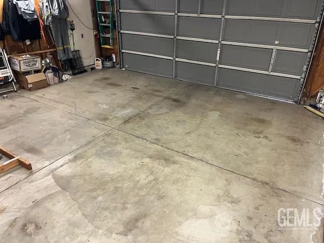 a view of an empty room with empty shelves