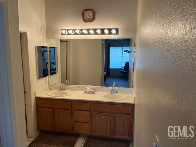 a bathroom with a sink and a mirror