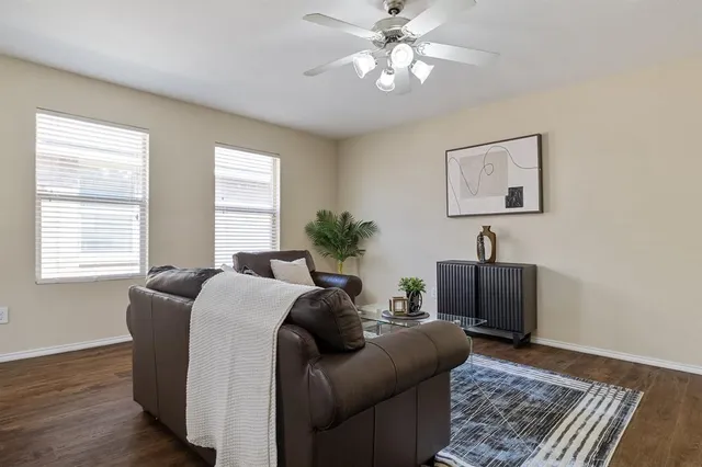 a living room with furniture and a window