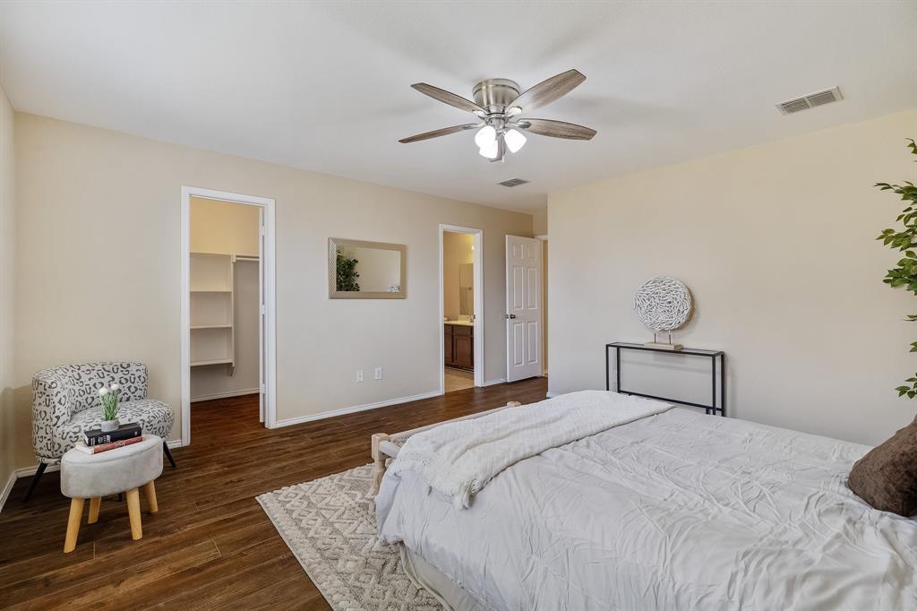 5016 Pacific Way Frisco, TX 75036 - Photo 6 of 24 a bedroom with a bed and wooden floor