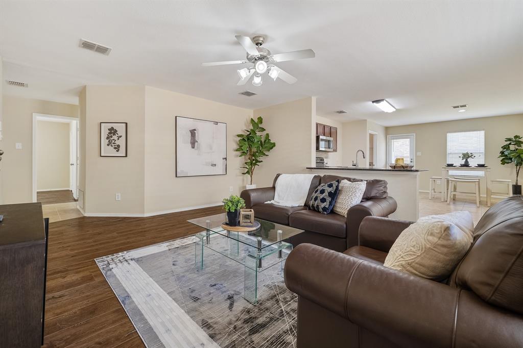 5016 Pacific Way Frisco, TX 75036 - Photo 8 of 24 a living room with furniture and a wooden floor