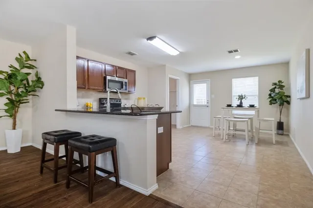 a kitchen with a table and chairs in it