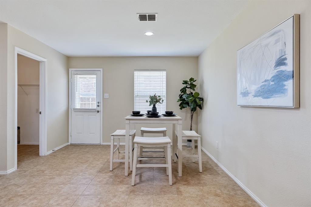 5016 Pacific Way Frisco, TX 75036 - Photo 10 of 24 a dining room with furniture and a potted plant
