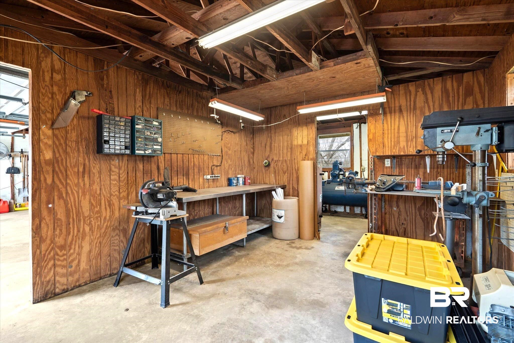 8090 Murray Hill Road Irvington, AL 36544 - Photo 7 of 40 Workshop area and a storage room
