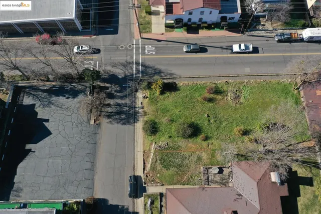 an aerial view of a houses with yard