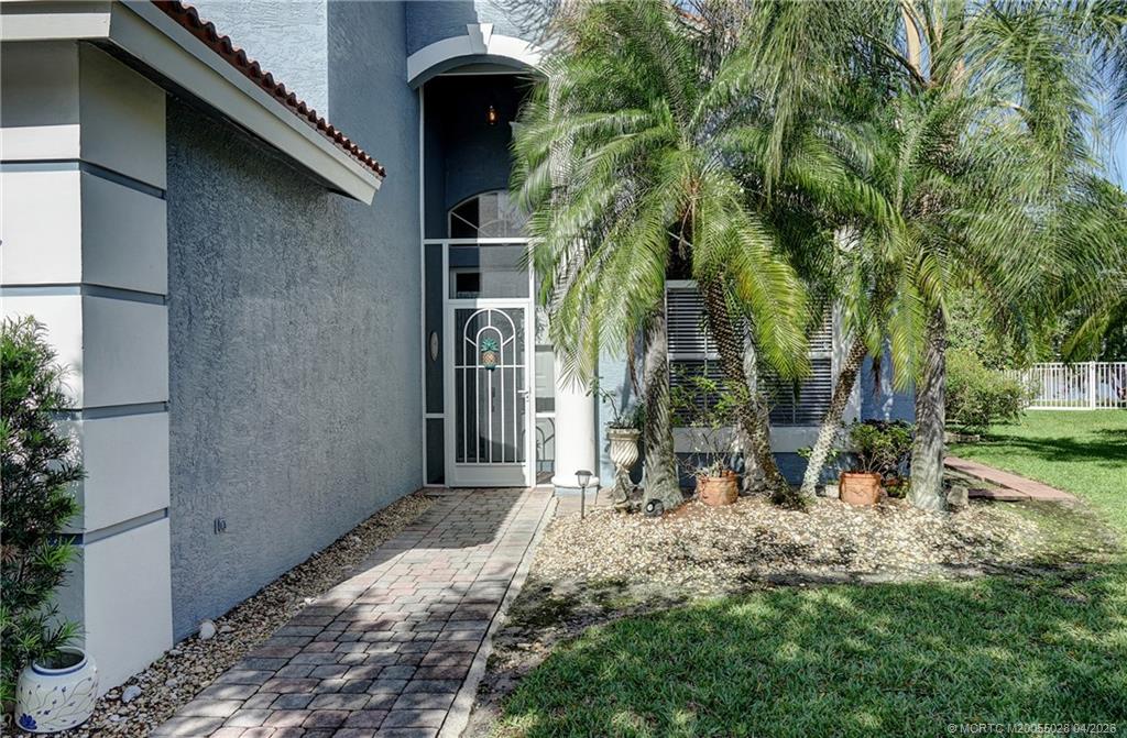 2120 Northwest Marsh Rabbit Lane Jensen Beach, FL 34957 - Photo 4 of 34 a backyard of a house with lots of green space