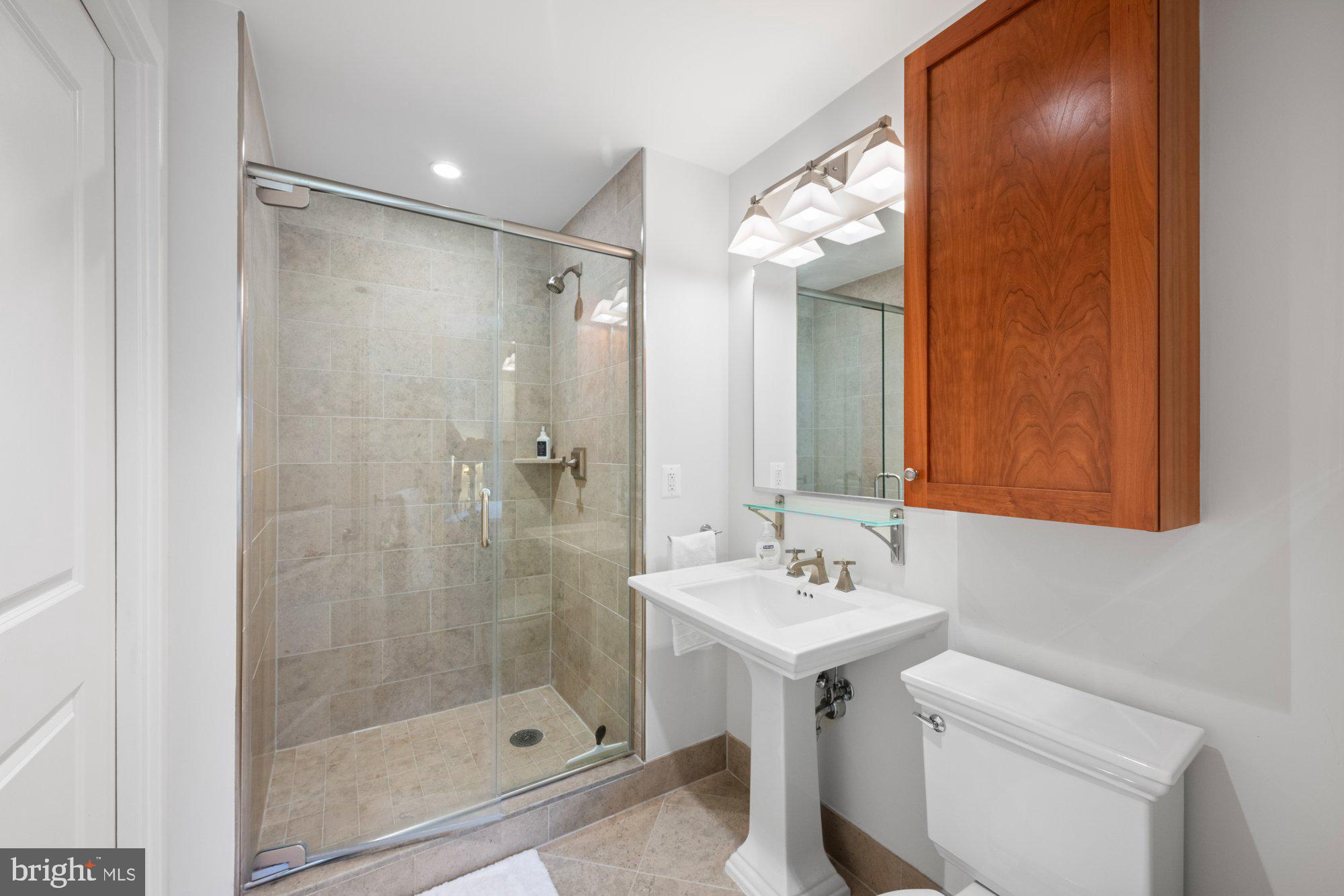 4301 Military Road Northwest, Unit 413 Washington, DC 20015 - Photo 13 of 24 Bath with large tile shower
