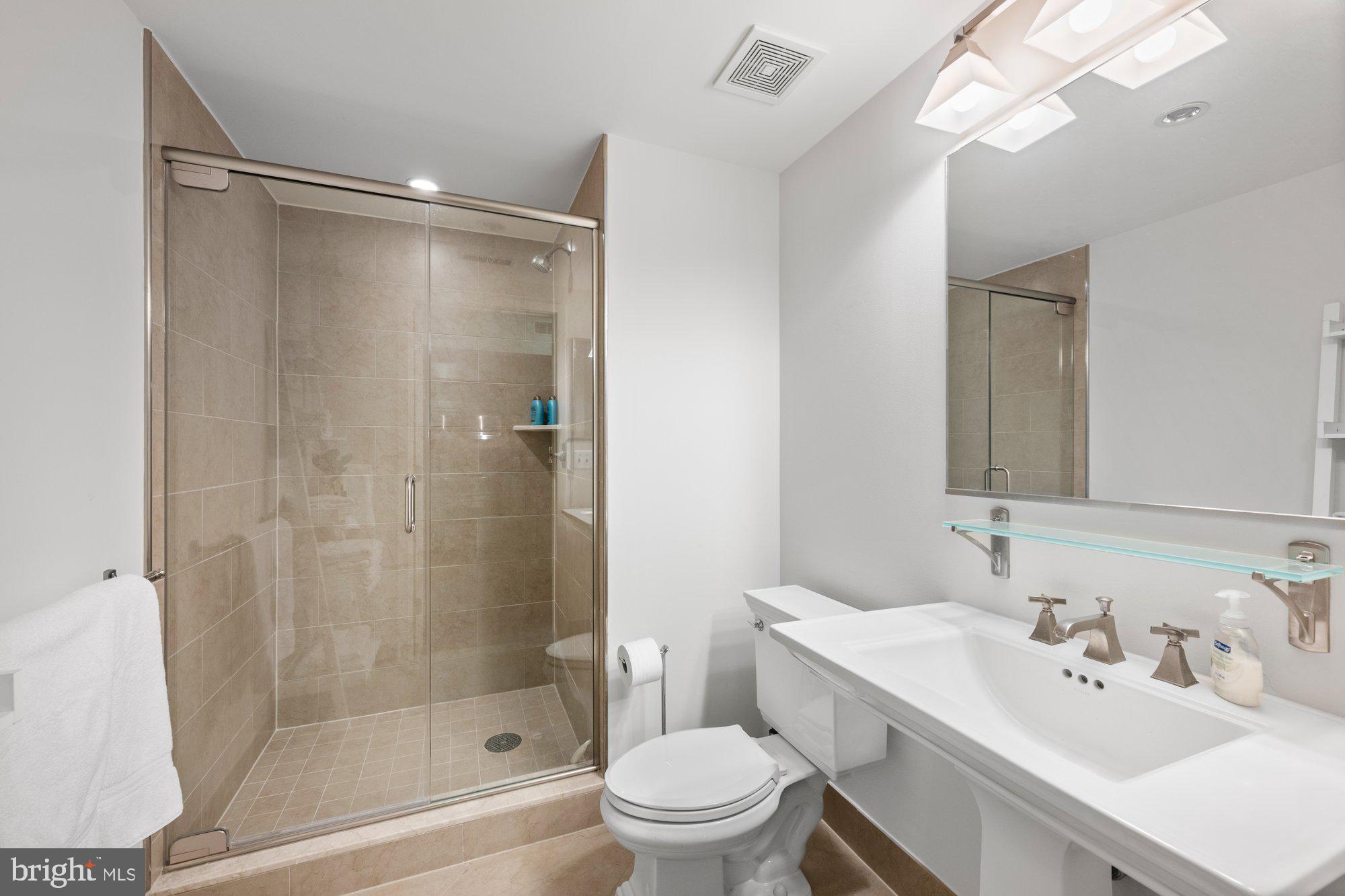 4301 Military Road Northwest, Unit 413 Washington, DC 20015 - Photo 15 of 24 Hall full bath with large shower