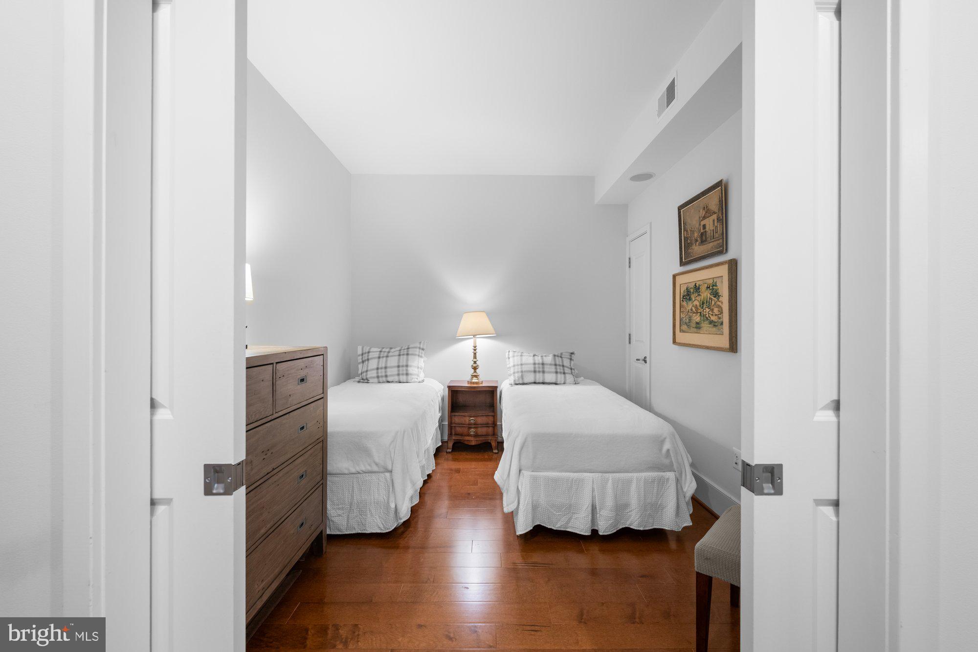 4301 Military Road Northwest, Unit 413 Washington, DC 20015 - Photo 6 of 24 Bedroom/flex space with pocket doors