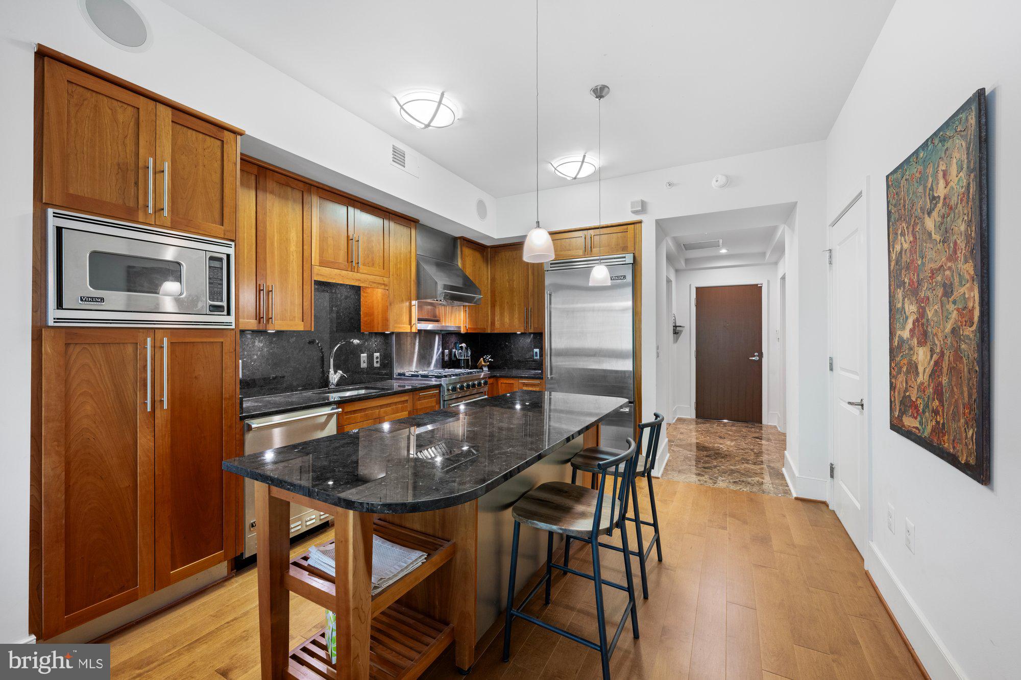 4301 Military Road Northwest, Unit 413 Washington, DC 20015 - Photo 8 of 24 Expansive island, granite counter tops