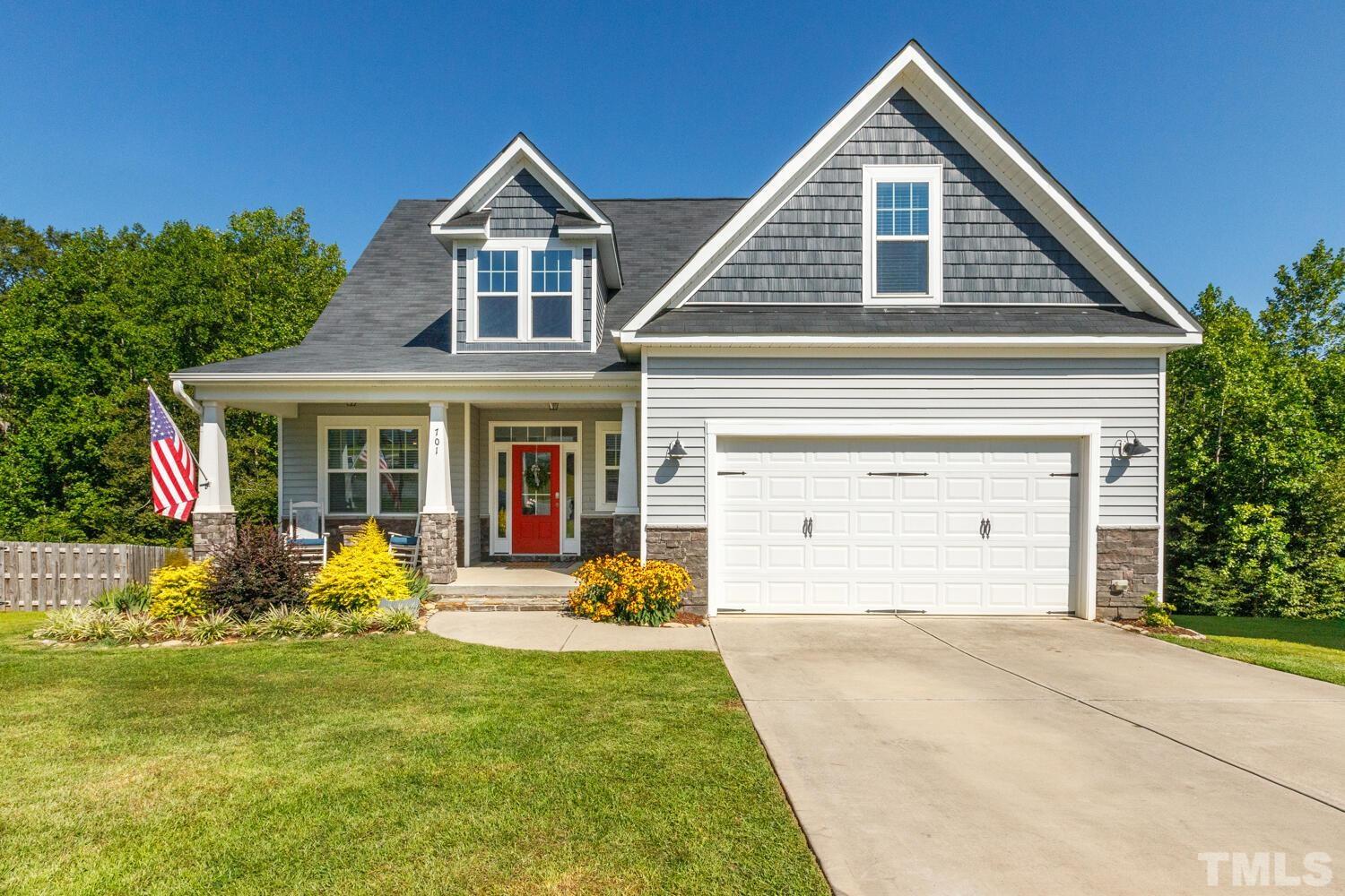 701 Summerwind Plantation Drive Garner, NC 27529 - Photo 1 of 48 front view of a house with a yard