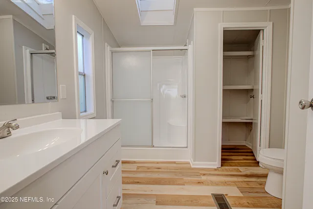 a bathroom view of a toilet and a sink