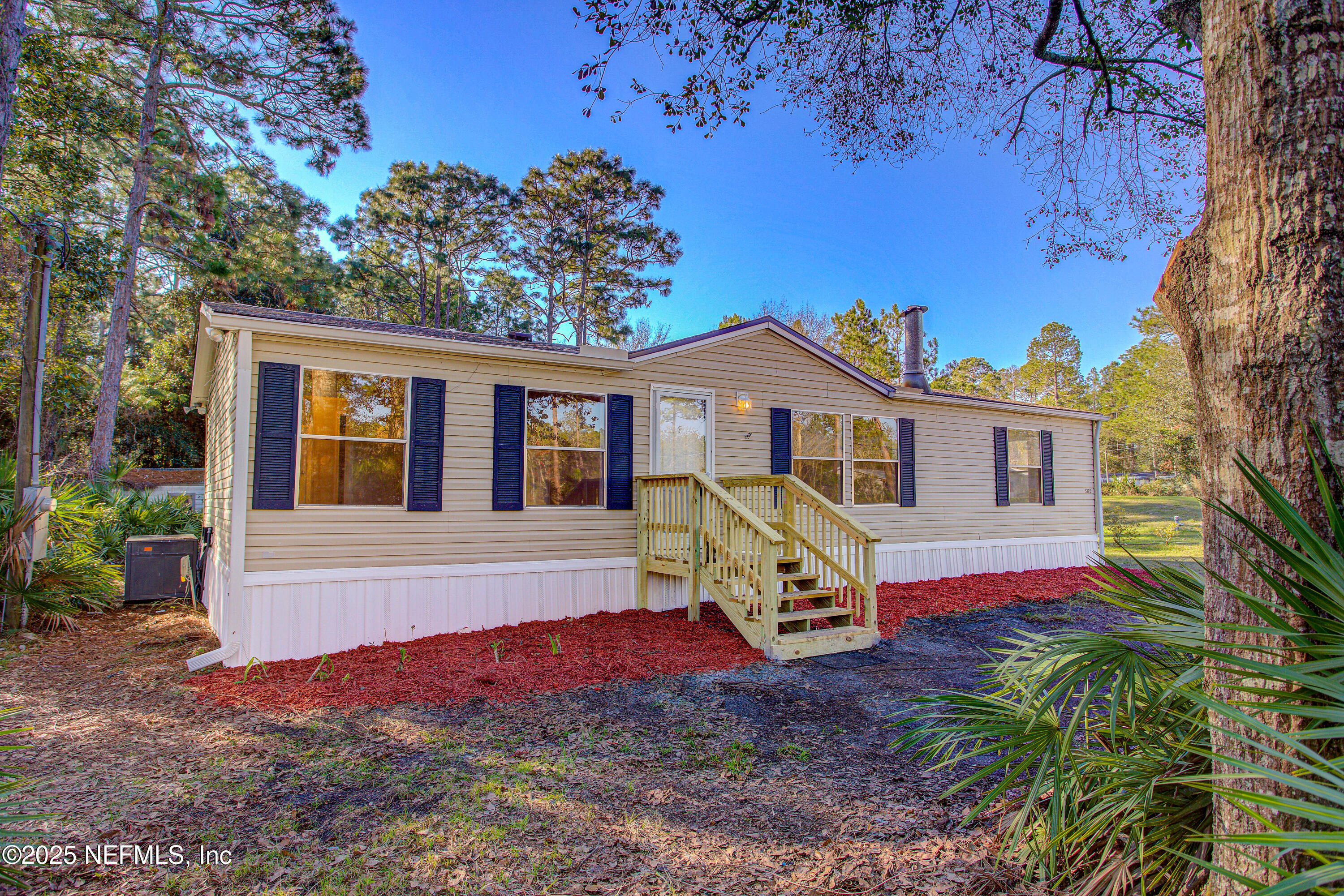 5175 Carter Spencer Road Middleburg, FL 32068 - Photo 38 of 41 a front view of a house with garden