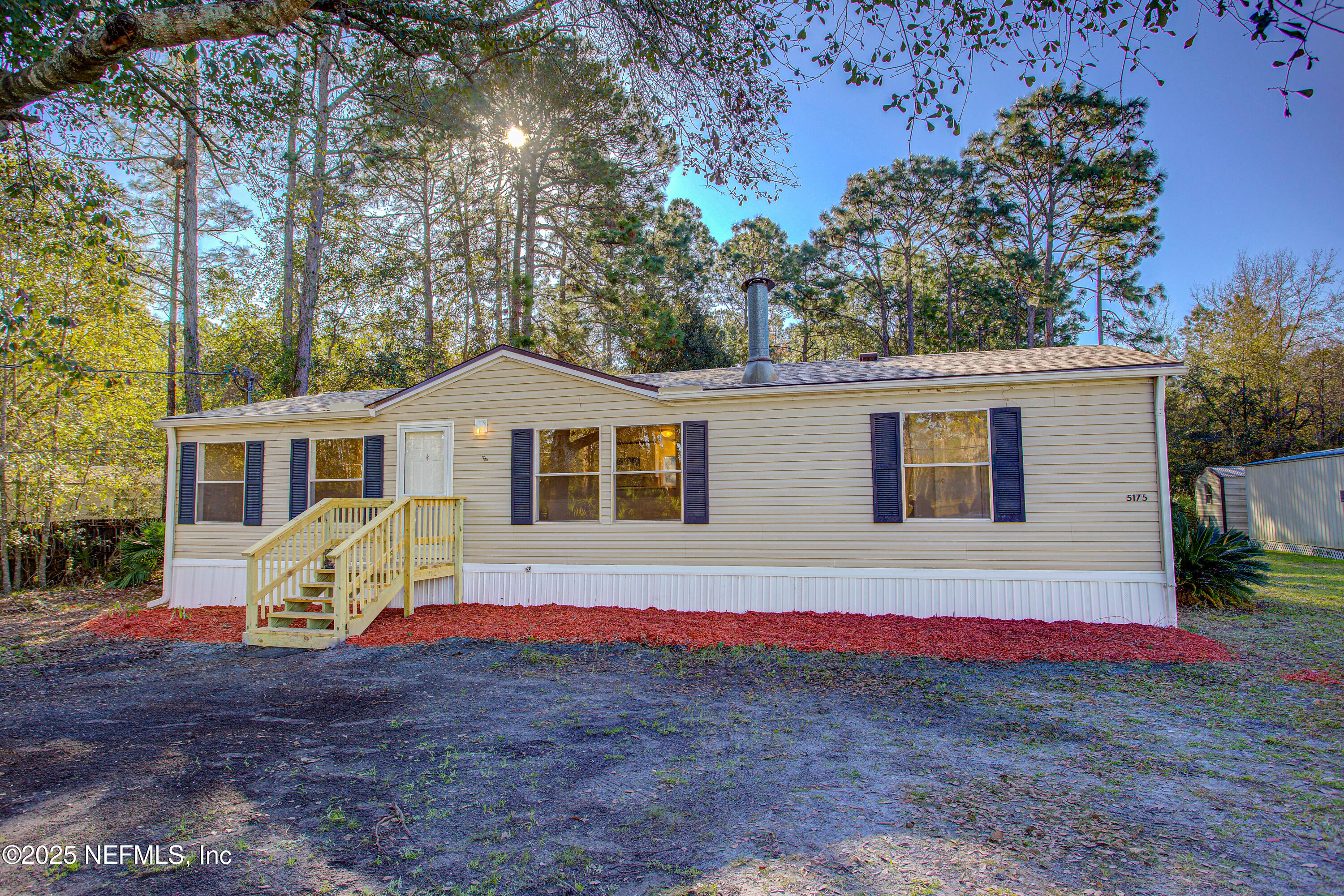 5175 Carter Spencer Road Middleburg, FL 32068 - Photo 39 of 41 a view of a house with a yard