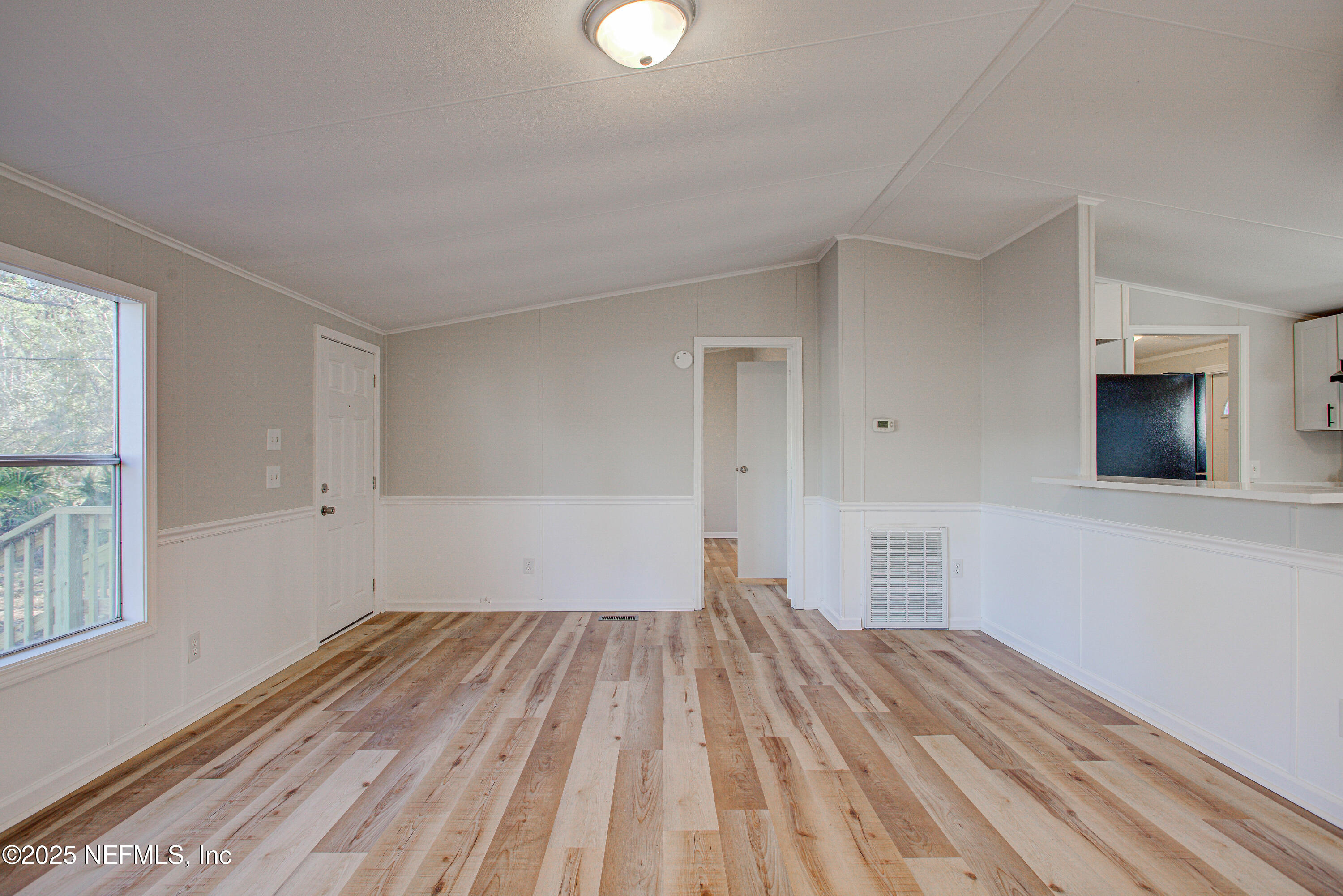5175 Carter Spencer Road Middleburg, FL 32068 - Photo 9 of 41 a view of empty room with wooden floor and fan