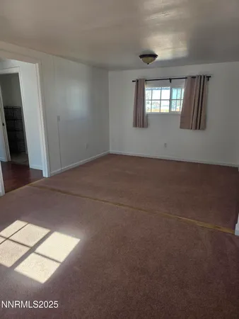 a view of an empty room and window