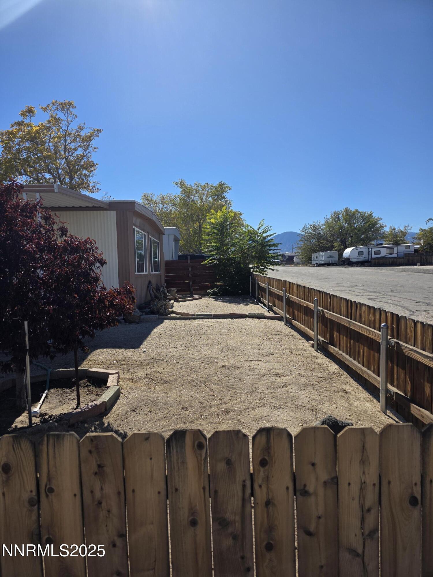 1110 4th Street Hawthorne, NV 89415 - Photo 4 of 27 a view of a backyard with wooden fence