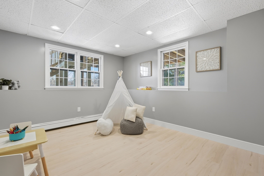 108 Cherry Street Framingham, MA 01701 - Photo 18 of 30 a bedroom with a bed and wooden floor