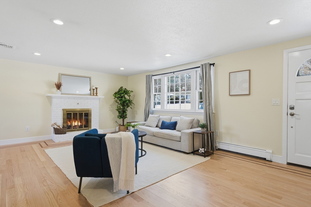 108 Cherry Street Framingham, MA 01701 - Photo 2 of 30 a living room with furniture and a fireplace