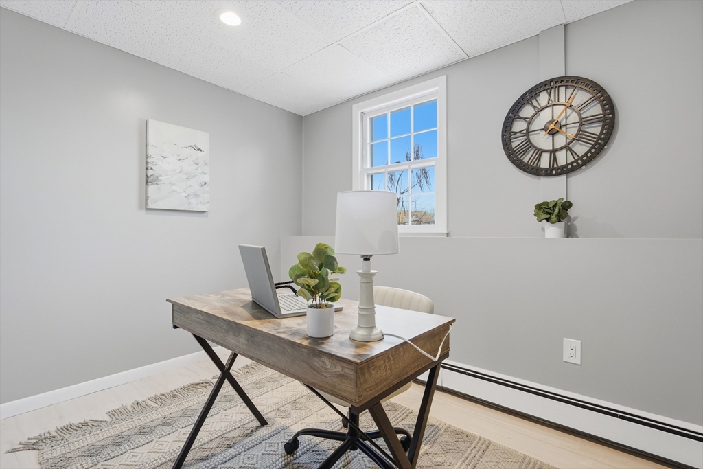 108 Cherry Street Framingham, MA 01701 - Photo 21 of 30 a view of a dining room with furniture and wooden floor